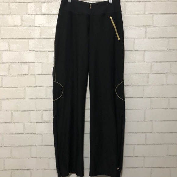 black and gold nike track pants